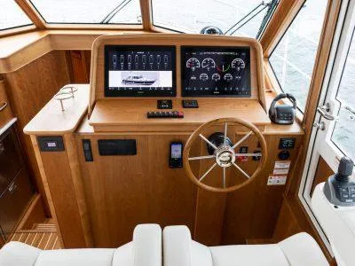 Slide: The Image of 2025 Sabre 43 Salon Express helm with modern navigation and control systems. - 5