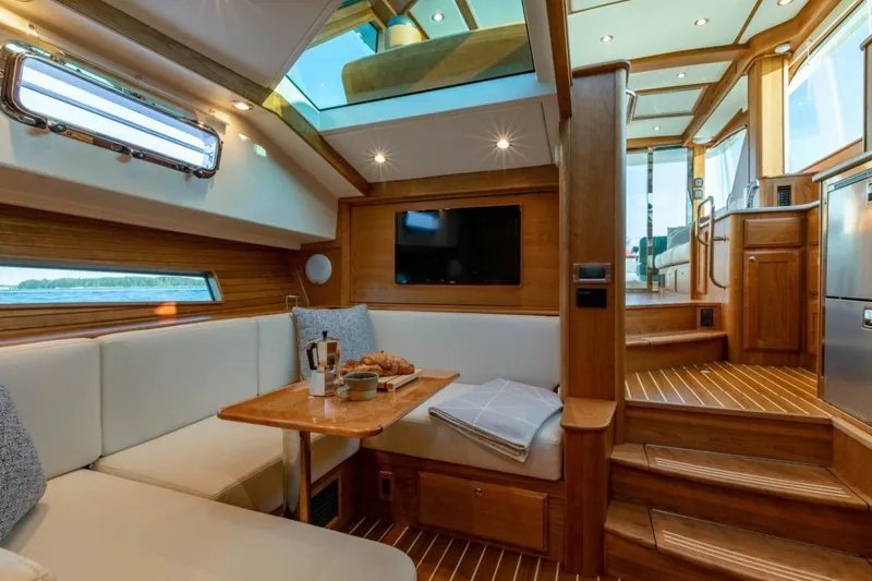 Slide: The Image of Luxurious interior of 2025 Sabre 43 Salon Express yacht with skylight and modern amenities. - 9