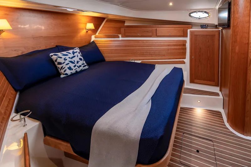 Slide: The Image of Luxurious cabin interior of 2027 Back Cove 412 yacht with elegant wood finish. - 9