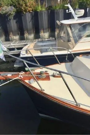 Slide: The Image of 1978 Fortier 26 boat docked in harbor. - 2