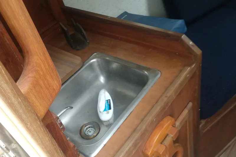 Slide: The Image of Galley area of a 1978 Fortier 26 boat with sink. - 21