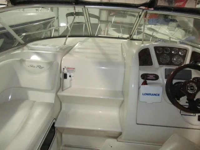 Slide: The Image of 2004 Sea Ray 260 Sundancer boat interior with steering wheel and dashboard. - 6