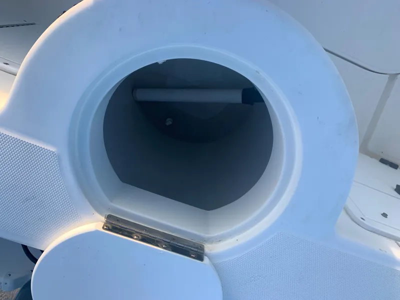 Slide: The Image of Open storage compartment on a 2003 Aquasport 225 Explorer boat. - 15