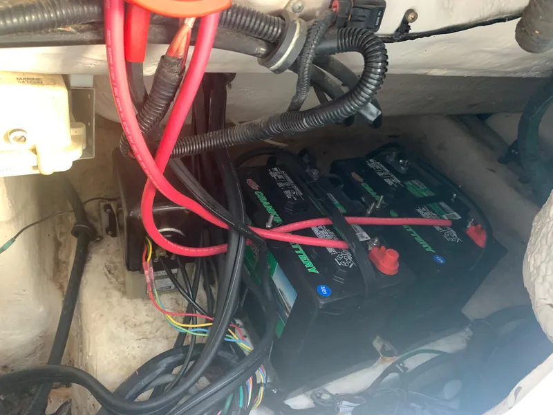 Slide: The Image of 2003 Aquasport 225 Explorer boat battery compartment with wiring. - 17