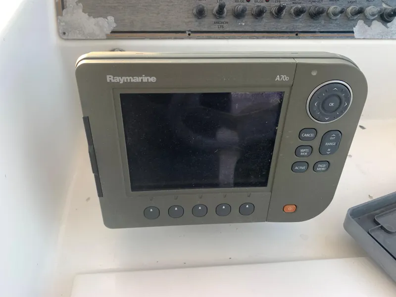 Slide: The Image of Raymarine A70 display on 2003 Aquasport 225 Explorer boat dashboard. - 20