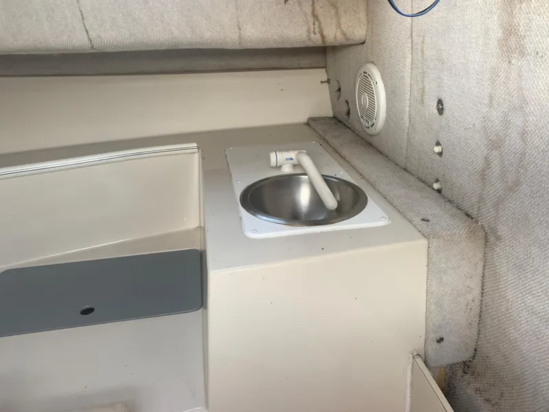 Slide: The Image of 2003 Aquasport 225 Explorer cabin interior with sink and speaker. - 23