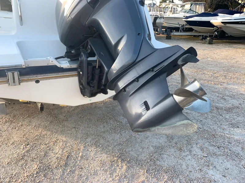 Slide: The Image of Close-up of 2003 Aquasport 225 Explorer outboard motor and propeller. - 5