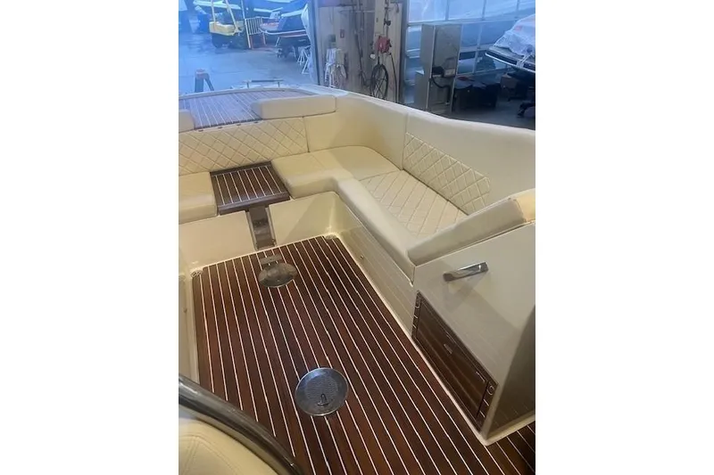Slide: The Image of 2021 Chris-Craft Corsair 34 interior with elegant seating and wooden flooring. - 12