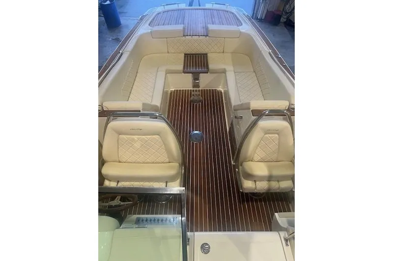 Slide: The Image of Luxurious 2021 Chris-Craft Corsair 34 boat interior with elegant seating and wooden flooring. - 13