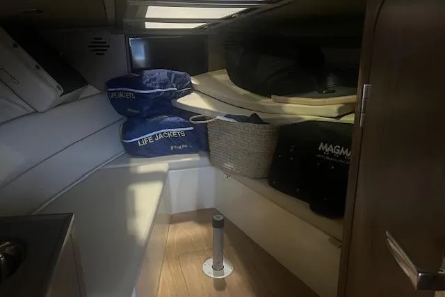 Slide: The Image of Interior cabin of 2021 Chris-Craft Corsair 34 with life jackets and storage. - 20