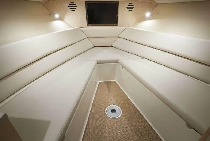 Slide: The Image of 2021 Chris-Craft Corsair 34 cabin interior with beige seating and ambient lighting. - 27