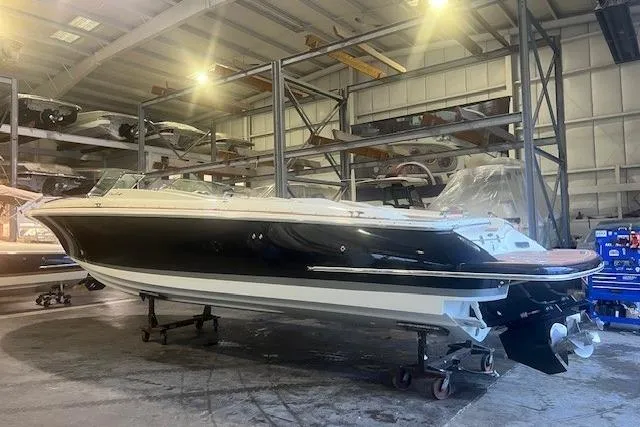 Slide: The Image of 2021 Chris-Craft Corsair 34 boat in storage, showcasing sleek design and craftsmanship. - 3