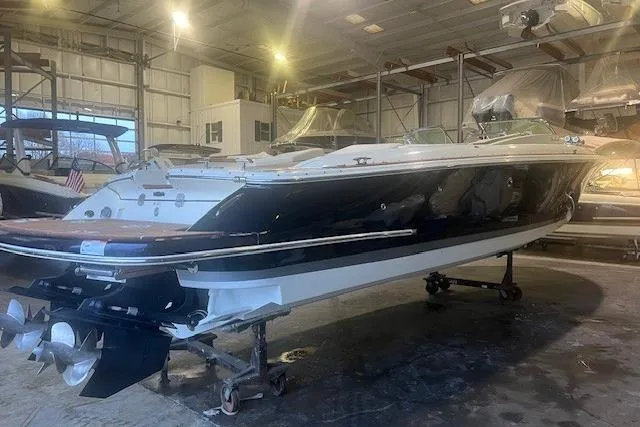 Slide: The Image of 2021 Chris-Craft Corsair 34 boat in a storage facility, showcasing sleek design and craftsmanship. - 6