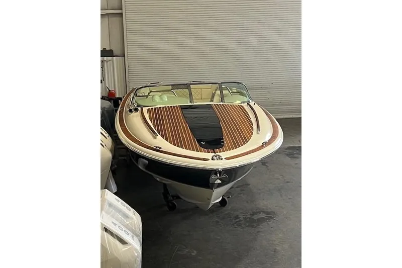 Slide: The Image of 2021 Chris-Craft Corsair 34 boat with sleek design in storage. - 7