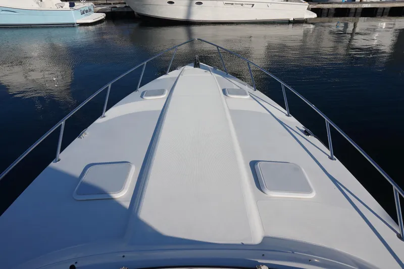 Slide: The Image of 2002 Formula 370 Super Sport yacht interior with seating and ocean view. - 11