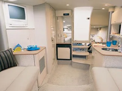 Slide: The Image of Luxury interior of 2002 Formula 370 Super Sport boat docked by the water. - 13