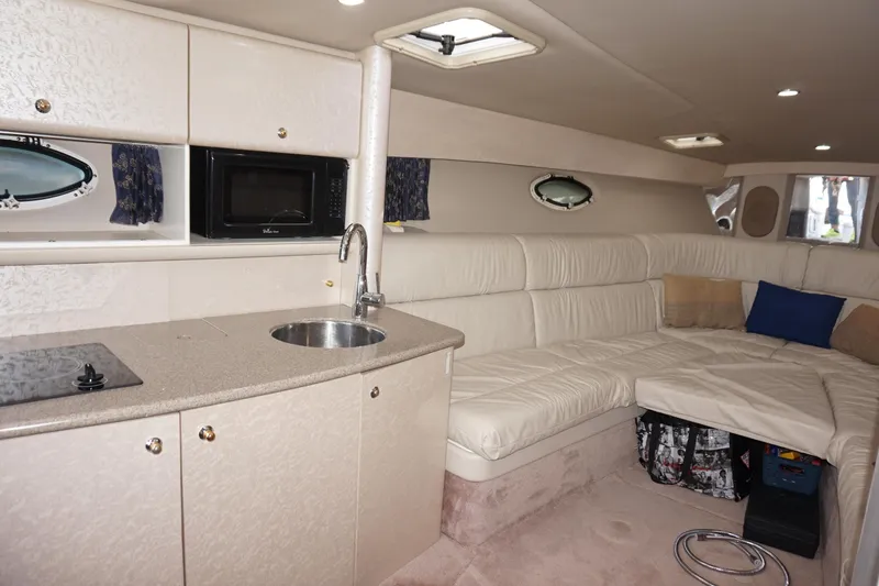 Slide: The Image of 2002 Formula 370 Super Sport boat docked at marina, front view. - 15