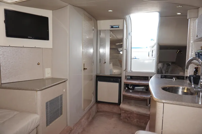 Slide: The Image of 2002 Formula 370 Super Sport boat deck at marina, calm water reflections. - 16