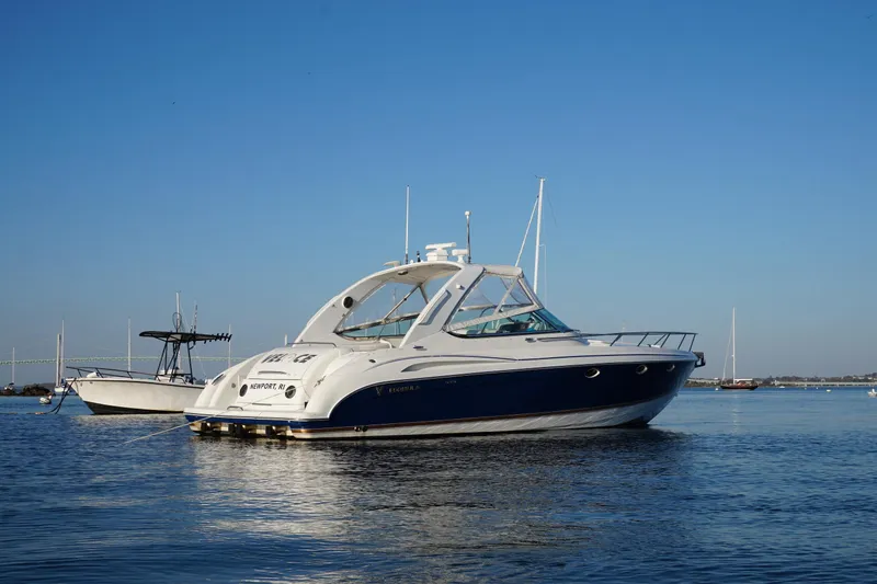 Slide: The Image of Aerial view of 2002 Formula 370 Super Sport boat cruising on green water. - 2