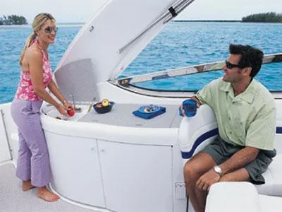 Slide: The Image of 2002 Formula 370 Super Sport yacht kitchenette with sink, stove, and microwave. - 23