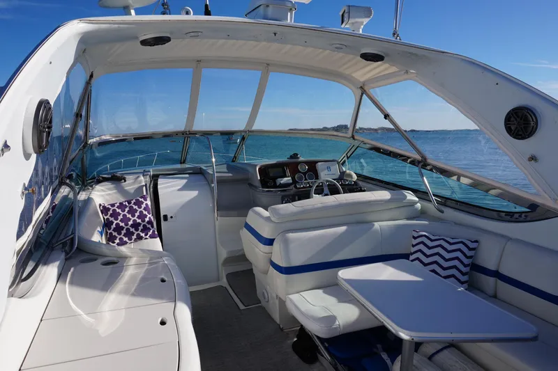 Slide: The Image of 2002 Formula 370 Super Sport boat cruising on a scenic lake. - 6