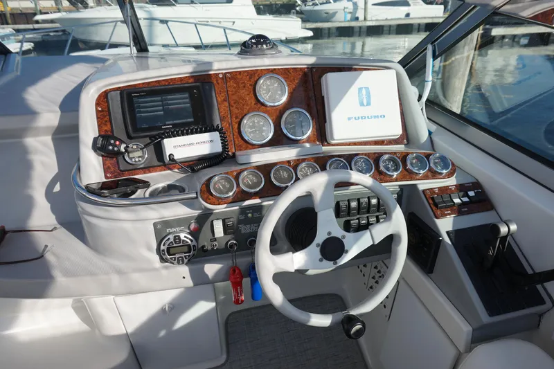 Slide: The Image of 2002 Formula 370 Super Sport boat cruising on open water. - 7