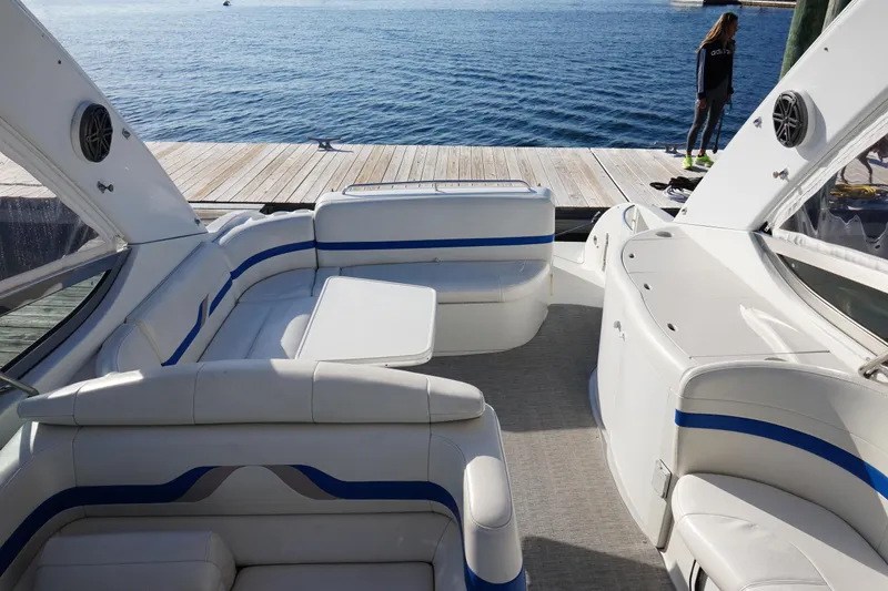 Slide: The Image of 2002 Formula 370 Super Sport boat docked in a marina, clear blue sky. - 8
