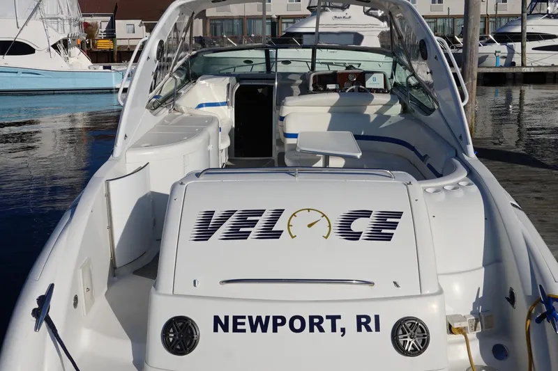 Slide: The Image of 2002 Formula 370 Super Sport boat docked at marina under clear blue sky. - 9