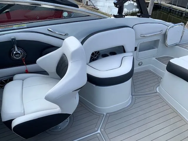 Slide: The Image of 2022 Crownline 255 SS boat interior with white and black seating. - 3