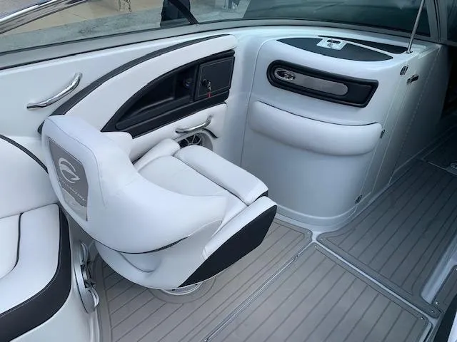Slide: The Image of 2022 Crownline 255 SS boat interior with white and black seating. - 5