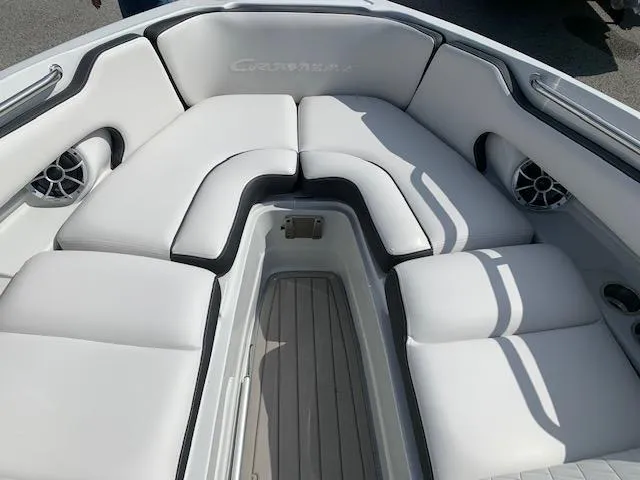 Slide: The Image of 2022 Crownline 255 SS boat with luxurious white seating and integrated speakers. - 8