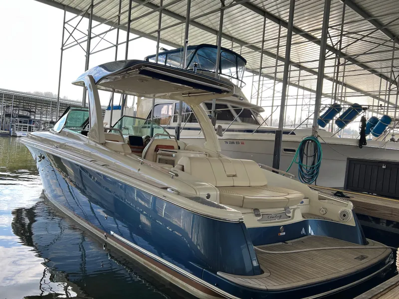 Slide: The Image of 2020 Chris-Craft Launch 31 GT boat docked in a marina. - 10