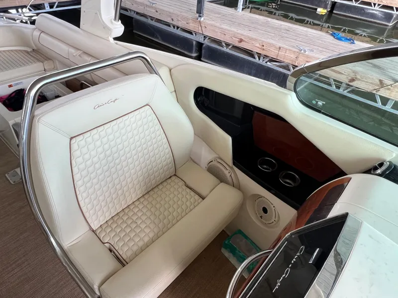 Slide: The Image of 2020 Chris-Craft Launch 31 GT interior with white leather seating and dashboard details. - 17