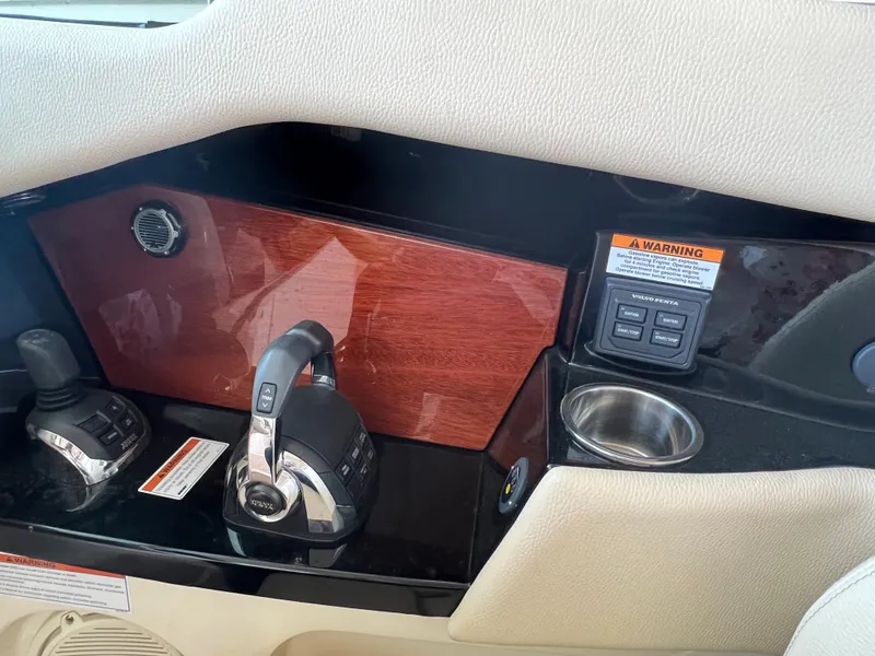 Slide: The Image of Control panel of 2020 Chris-Craft Launch 31 GT boat with joystick and cup holder. - 25