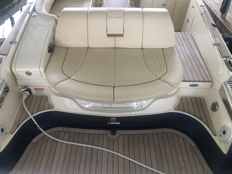 Slide: The Image of 2020 Chris-Craft Launch 31 GT boat with beige seating and teak flooring. - 48