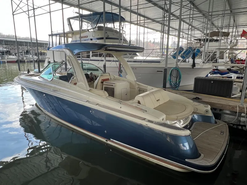 Slide: The Image of 2020 Chris-Craft Launch 31 GT boat docked in a marina. - 5