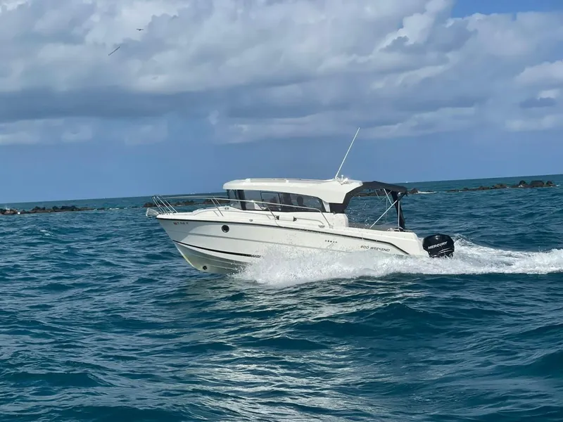 Slide: The Image of Parker 800 Weekend 2021 motorboat cruising on open sea under cloudy sky. - 10