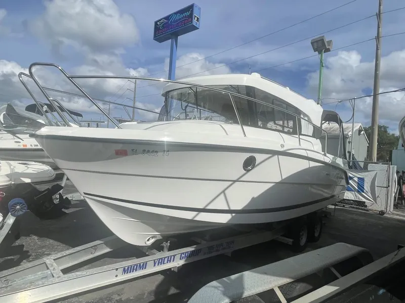 Slide: The Image of Parker 800 Weekend 2021 motorboat cruising on open water under clear blue sky. - 19