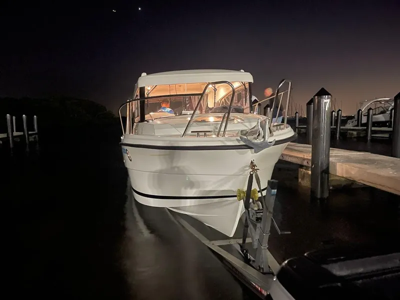 Slide: The Image of Parker 800 Weekend 2021 boat docked at night with lights on. - 2