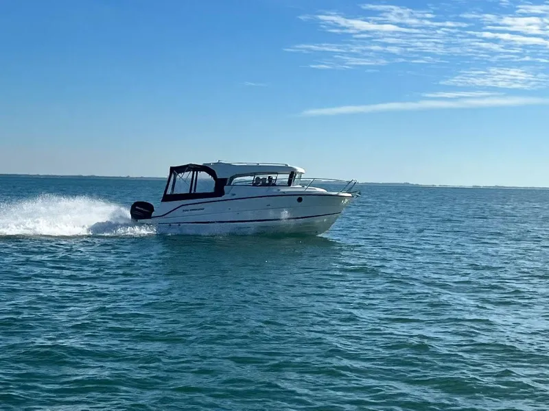 Slide: The Image of Interior of 2021 Parker 800 Weekend boat with modern dashboard and seating area. - 20