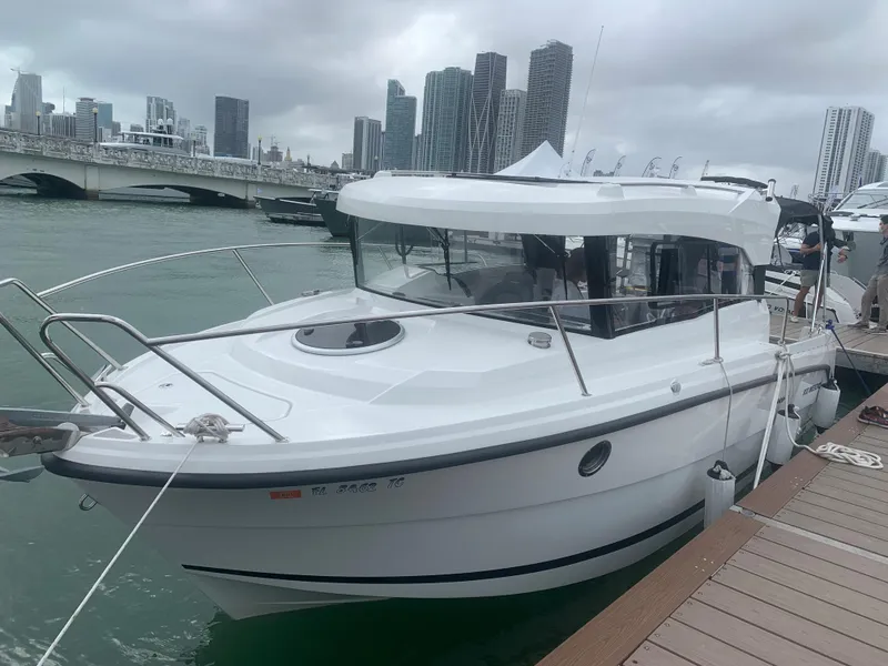 Slide: The Image of 2021 Parker 800 Weekend boat docked with city skyline in background. - 3
