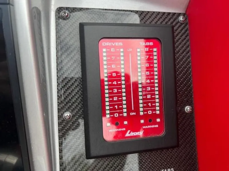 Slide: The Image of Control panel of a 2016 Cigarette 50' Marauder boat with carbon fiber trim. - 11