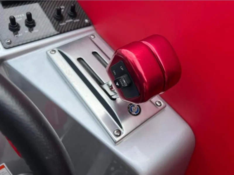 Slide: The Image of Red throttle control on 2016 Cigarette 50' Marauder boat dashboard. - 12