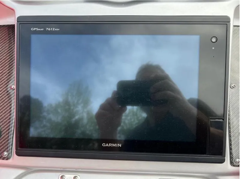 Slide: The Image of Garmin GPS display on 2016 Cigarette 50' Marauder boat dashboard. - 13