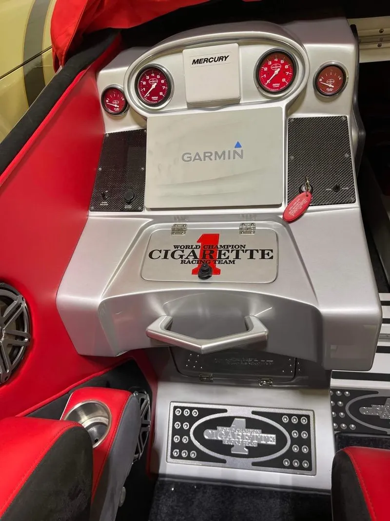 Slide: The Image of Interior dashboard of a 2016 Cigarette 50' Marauder boat with Garmin navigation. - 14