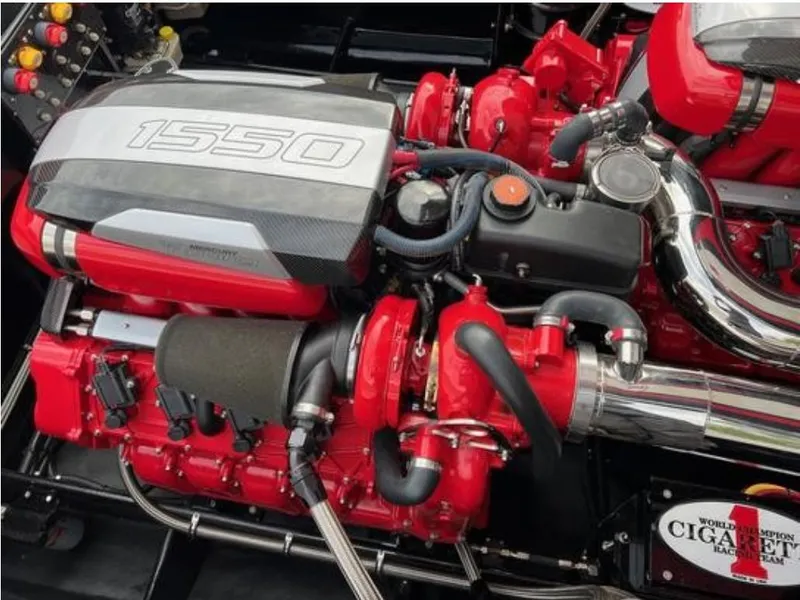 Slide: The Image of 2016 Cigarette 50' Marauder engine, red and silver components, high-performance design. - 25