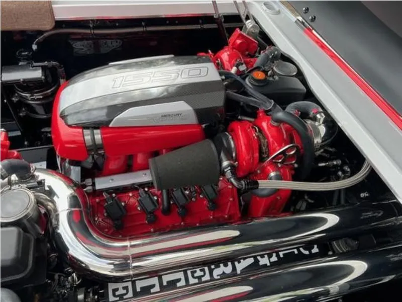 Slide: The Image of 2016 Cigarette 50' Marauder engine, vibrant red and chrome detailing, high-performance design. - 26