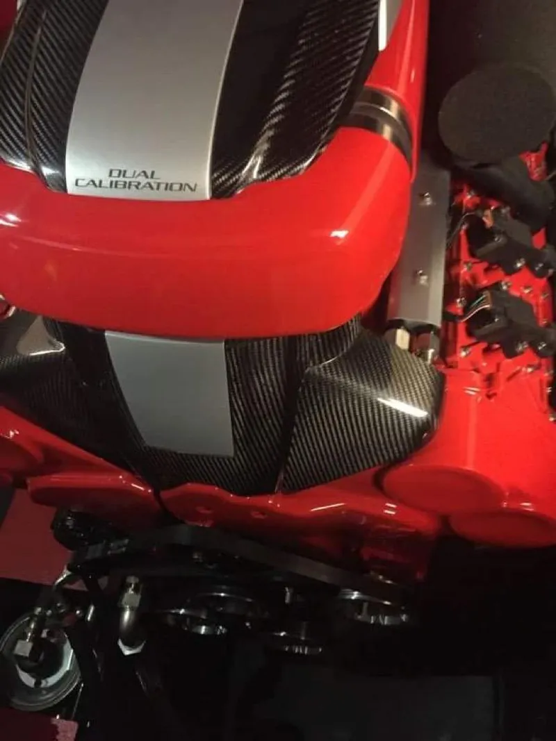 Slide: The Image of Engine detail of a 2016 Cigarette 50' Marauder with dual calibration, red and black design. - 27