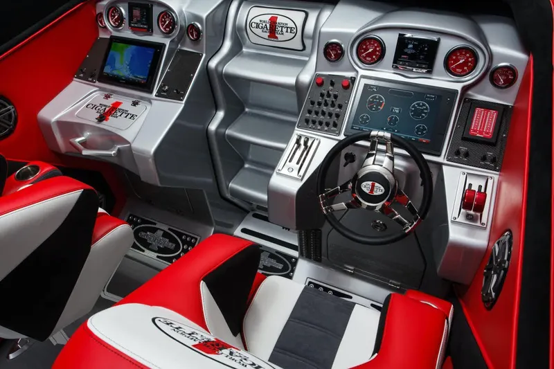 Slide: The Image of Cockpit of 2016 Cigarette 50' Marauder with advanced controls and red accents. - 8