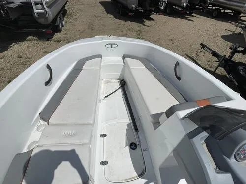 Slide: The Image of 2019 Tahoe T16 boat interior with white seating and storage compartments. - 5